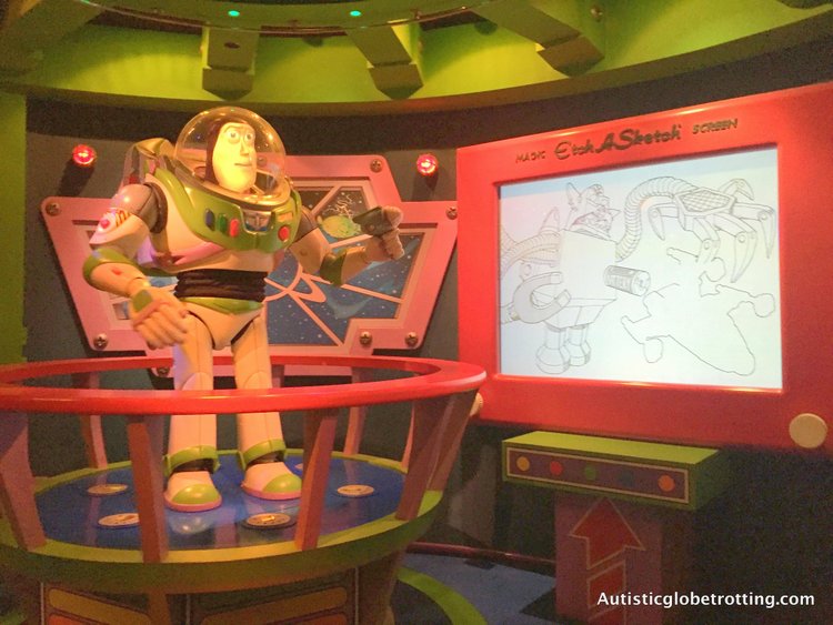 Best Disneyland Spinning Rides for Kids with Autism buzz laser game