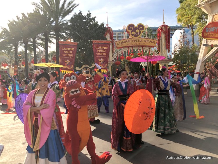 Attending Disneyland's Lunar Year Celebrations with Autism mulan and her ladies dancing at the procession