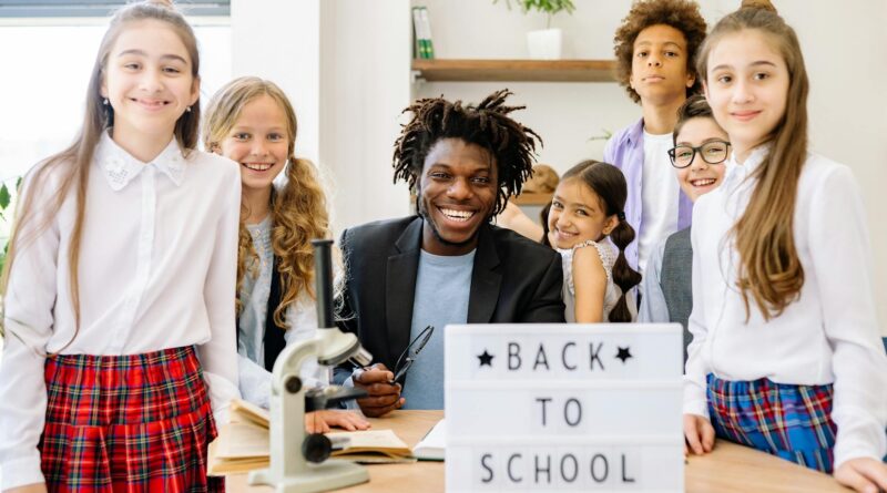 a man and children smiling together